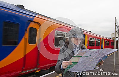 Tourist woman in train station Stock Photo