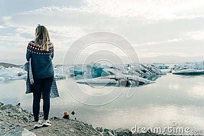 tourist woman on travel on Iceland by Jokulsarlon glacial lagoon on Iceland Stock Photo