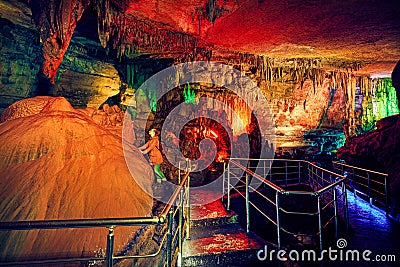 Tourist in underground cave Stock Photo