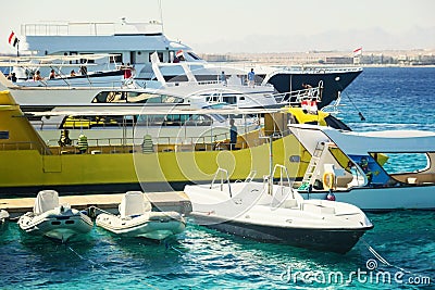 Tourist yachts and boats near the pier in Hurghada. Egypt. Editorial Stock Photo