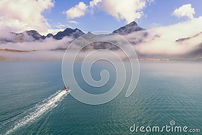 a tourist Zodiac enters the foggy bay of the now abandoned whaling station at Grytviken - on South Georgia. Stock Photo