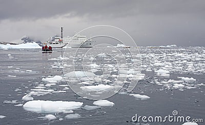 Tourist in a zodiac traveling in antarctic waters Editorial Stock Photo