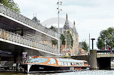 Touristic boat in a canal in Amsterdam Editorial Stock Photo