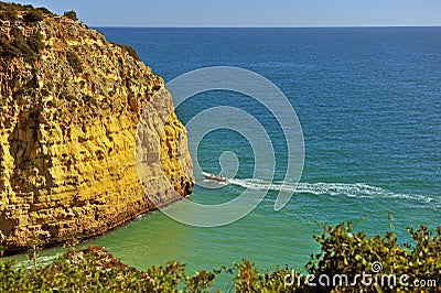 Touristic boat near the cliff at Carvoeiro Stock Photo