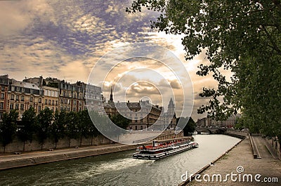 Touristic boat on Seine river in Paris, France. Stock Photo