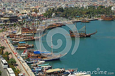 Touristic sailboats setting off to the Mediterranean sea in the ancient port of Alanya city. Antalya, Turkey. Stock Photo