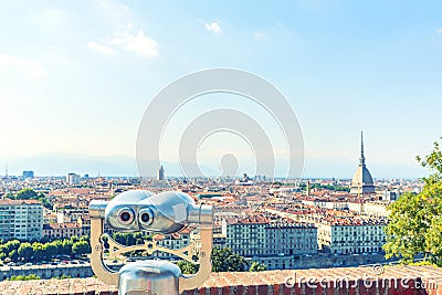 Touristic telescope look at the city center of Torino Turin, Italy, close up metal binoculars on background viewpoint overlookin Stock Photo