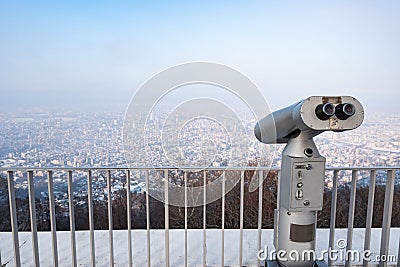 Touristic telescope look at city with view of Moiwa Stock Photo