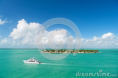 Touristic yachts floating by green island at Key West, Florida Stock Photo