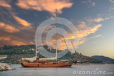 Touristical wooden Sailing vessel in the old harbor of Skiathos town, Sporades islands, Greece Editorial Stock Photo