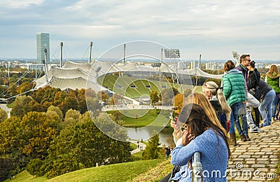 Tourists admiring the Olympic stadium in Olympiapark Editorial Stock Photo