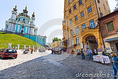 Tourists on Andriyivskyy Descent and Church Editorial Stock Photo