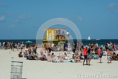 Tourists around a lifeguard stand on South Beach in Miami Editorial Stock Photo