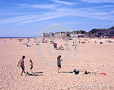 Tourists on Barmouth beach. Editorial Stock Photo