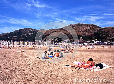 Tourists on Barmouth beach. Editorial Stock Photo