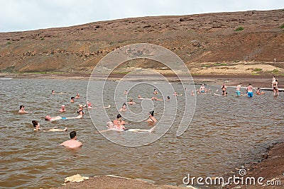 Tourists bathing in the salt crater lake. Pedra de Lume. Sal island. Cape Verde Editorial Stock Photo