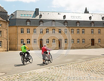 Tourists on bicycles, old European city Editorial Stock Photo