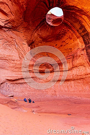 Tourists at the Big Hogan Formation in Monument Valley, Arizona Stock Photo