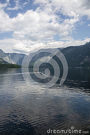 Tourists by boat on Lake Hallstattersee Stock Photo