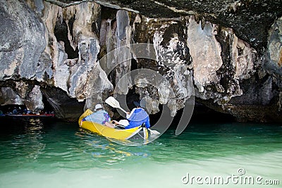 Tourists in boat swim into the cave of the island. Editorial Stock Photo