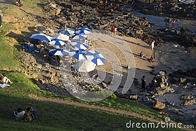 Tourists and Brazilians bathe at Farol da Barra beach in Salvador, Brazil Stock Photo