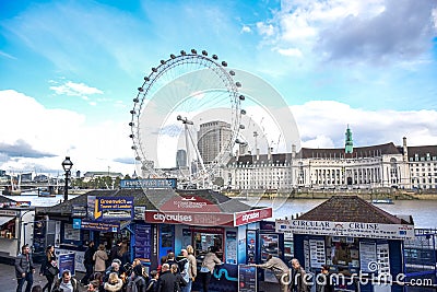 Tourists buying cruise tickets at Westminster pier by River Thames in London Editorial Stock Photo