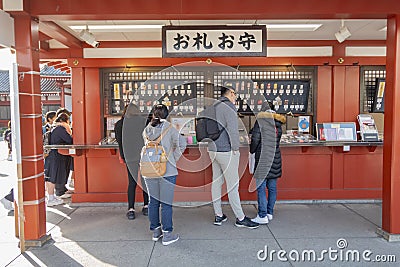 The Tourists are buying some amulet and talisman at amulet shop in Asakusa temple in Tokyu, Japan February 7,2020 Editorial Stock Photo