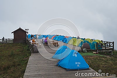 Tourists camping along wooden plank paths on top of Wugong Mountain Wugongshan Editorial Stock Photo