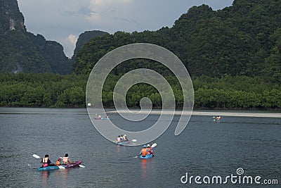 Tourists canoe to visit the island in Southern Thailand. Editorial Stock Photo