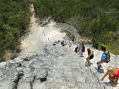 Tourists climbing a Mayan pyramid in Mexico Editorial Stock Photo