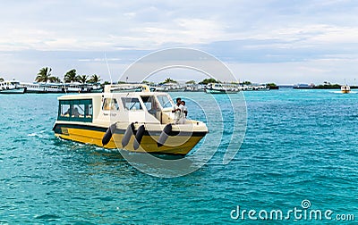 Tourists coming by speedboats to the international airport of Ibrahim Nasir Editorial Stock Photo