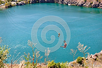 A zipline cable car across a radon lake near the village of Migia, Ukraine, has emerged on the site of an old granite quarry Editorial Stock Photo