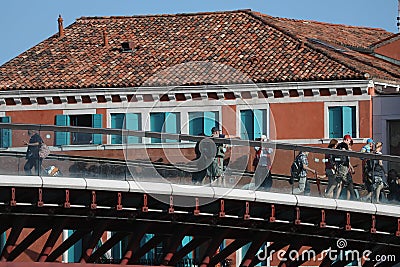 Tourists crossing new modern bridge in Venice, Italy Editorial Stock Photo