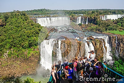 Tourists crowded at viewpoint platform in wonderful Iguacu Falls Editorial Stock Photo