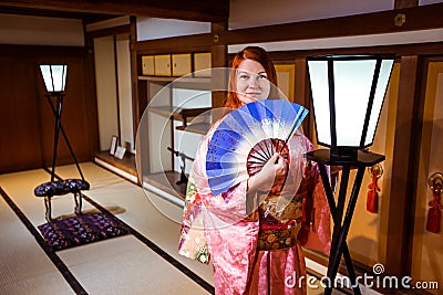 Tourists dressed into the Beautiful National Kimono in the Japanese Castle Editorial Stock Photo