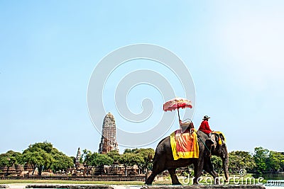 Tourists on an elephant ride tour of the ancient city at Ayutthaya, Thailand. Editorial Stock Photo