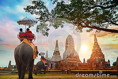 Tourists with Elephants at Wat Chaiwatthanaram temple in Ayuthaya Historical Park, Thailand Stock Photo