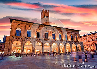 Tourists enjoing beautiful summer evening on main square of City of Bologna with popular historical place - Palazzo Re Enzo. Editorial Stock Photo