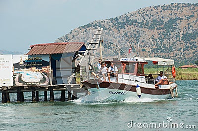 Tourists enjoy river cruise by the Dalyan river in Mugla, Turkey. Editorial Stock Photo