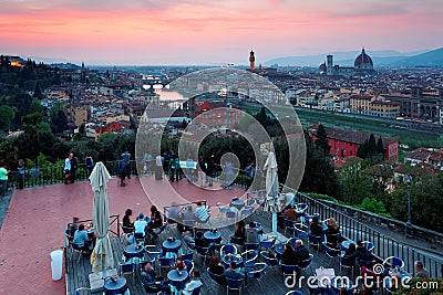 Tourists enjoying a panoramic view from Piazzale Michelangelo Square over Old Town Florence Editorial Stock Photo