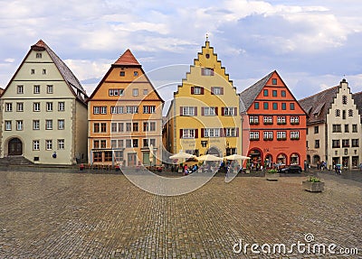 Tourists enjoying shopping, and architecture in Markplatz with traditional houses, Rothenburg ob der Tauber Editorial Stock Photo