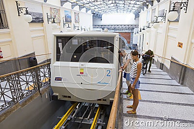 Tourists entering the funicular at Atan Stazione Funicolare Centrale Stock Photo