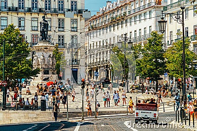 Tourists exploring square of Luis de Camoes in Lisbon Editorial Stock Photo