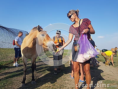 Tourists feed animals in Askania-Nova Editorial Stock Photo