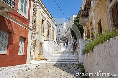 Tourists Going Up and Down on the Steps of Kali Strata on Symi, Greece Editorial Stock Photo