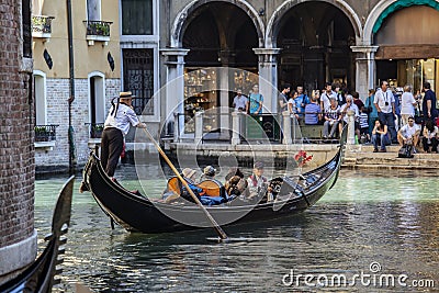 Tourists in a gondola, Venice, Italy Editorial Stock Photo