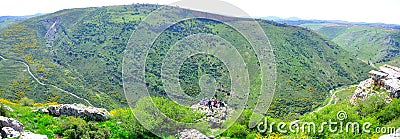 Tourists and guide on cliff edge, Israel Editorial Stock Photo