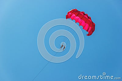 Tourists have fun, parachuting behind a boat, parasailing. Editorial Stock Photo