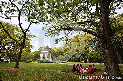 Tourists have a picnic in Botanic gardens Bandstand in Singapore Editorial Stock Photo