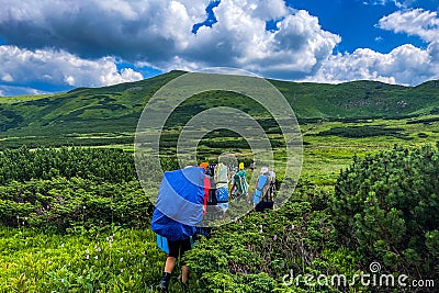 Tourists hike on rocky mounts Editorial Stock Photo